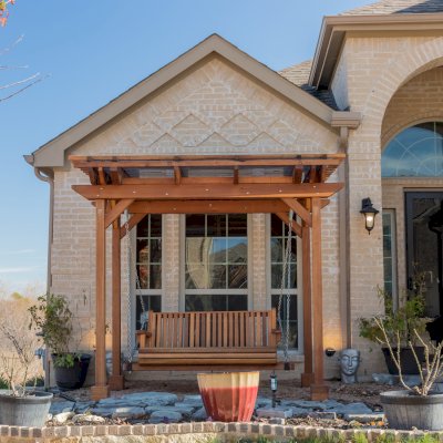 Angel's Trellis Swing (Options: 9' x 6', California Redwood, with Rain Guard, Classic Design Seat, 7.5' Posts by Custom Request, Post Anchoring for Concrete, Transparent Premium Sealant). Photo Courtesy of C. Edwards of Fort Worth, TX.