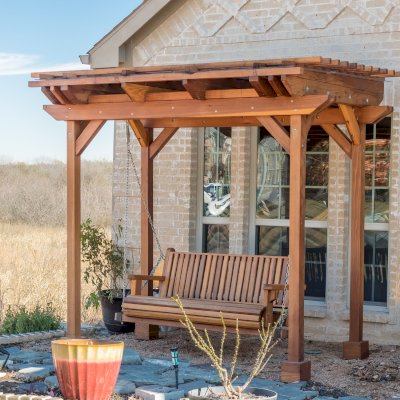 Angel's Trellis Swing (Options: 9' x 6', California Redwood, with Rain Guard, Classic Design Seat, 7.5' Posts by Custom Request, Post Anchoring for Concrete, Transparent Premium Sealant). Photo Courtesy of C. Edwards of Fort Worth, TX.