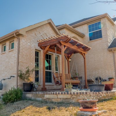 Angel's Trellis Swing (Options: 9' x 6', California Redwood, with Rain Guard, Classic Design Seat, 7.5' Posts by Custom Request, Post Anchoring for Concrete, Transparent Premium Sealant). Photo Courtesy of C. Edwards of Fort Worth, TX.