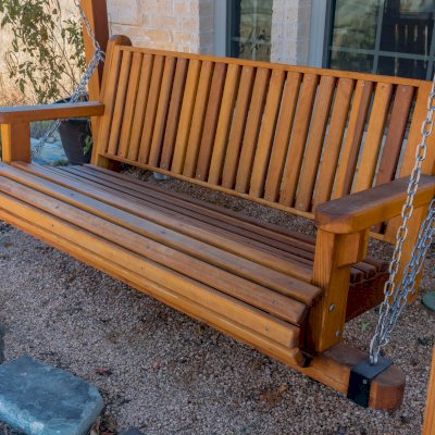 Angel's Trellis Swing (Options: 9' x 6', California Redwood, with Rain Guard, Classic Design Seat, 7.5' Posts by Custom Request, Post Anchoring for Concrete, Transparent Premium Sealant). Photo Courtesy of C. Edwards of Fort Worth, TX.
