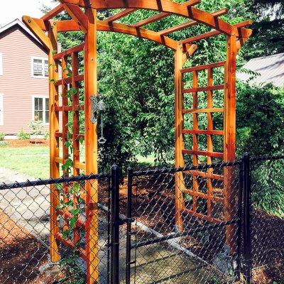 Arched Garden Arbor (Options: 60" W x 36" D, California Redwood, No Anchor Kit, Transparent Premium Sealant). Photo Courtesy of Evelyn and Dan Martin of Poulsbo, Washington.