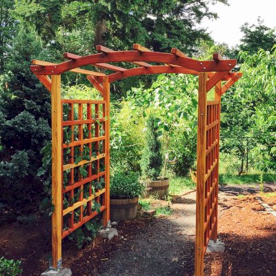 Arched Garden Arbor (Options: 48" W x 60" D, California Redwood, No Anchor Kit, Transparent Premium Sealant). Photo Courtesy of Evelyn and Dan Martin of Poulsbo, Washington.