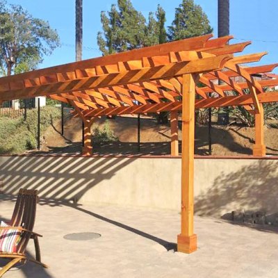 Arched Open Sky Pergolas (Options: 22' L x 15' Arc W, Douglas-fir, No Electrical Wiring Trims, 4-Post Anchor Kit for Concrete, 2' Overhangs by Custom Request, No Ceiling Fan Base, No Privacy Panels, No Curtain Rods, 2 Posts are 10' H and the Posts on the Pony Wall are 5' H, Transparent Premium Sealant). Photo Courtesy of J. Marca of Escondido, California.