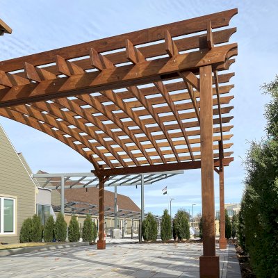 Arched Open Sky Pergolas (Options: 16' L x 20' Arc W, Mature Redwood, No Electrical Wiring Trim, 4-Post Anchor Kit for Concrete, No Ceiling Fan Base, No Privacy Panels, No Curtain Rods, 9.5' Post Height, Transparent Premium Sealant). Photo Courtesy of S. Glancy of Gibsonia, PA.