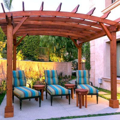 Arched Open Sky PergolaArched Open Sky Pergolas (Options: 11' L x 13' Arc W, Mature Redwood, Unattached, No Electrical Wiring Trim, 4-Post Anchor Kit for Concrete, No Ceiling Fan Base, No Privacy Panels, No Curtain Rods, 9' Post Height, Transparent Premium Sealant). Photo courtesy of G. Gigante of Glendora, CA.