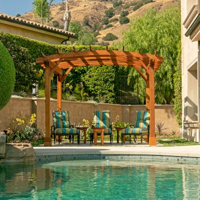 Arched Open Sky PergolaArched Open Sky Pergolas (Options: 11' L x 13' Arc W, Mature Redwood, Unattached, No Electrical Wiring Trim, 4-Post Anchor Kit for Concrete, No Ceiling Fan Base, No Privacy Panels, No Curtain Rods, 9' Post Height, Transparent Premium Sealant). Photo courtesy of G. Gigante of Glendora, CA.
