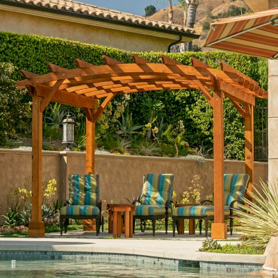 Arched Open Sky PergolaArched Open Sky Pergolas (Options: 11' L x 13' Arc W, Mature Redwood, Unattached, No Electrical Wiring Trim, 4-Post Anchor Kit for Concrete, No Ceiling Fan Base, No Privacy Panels, No Curtain Rods, 9' Post Height, Transparent Premium Sealant). Photo courtesy of G. Gigante of Glendora, CA.