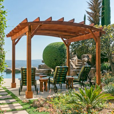 Arched Open Sky PergolaArched Open Sky Pergolas (Options: 11' L x 13' Arc W, Mature Redwood, Unattached, No Electrical Wiring Trim, 4-Post Anchor Kit for Concrete, No Ceiling Fan Base, No Privacy Panels, No Curtain Rods, 9' Post Height, Transparent Premium Sealant). Photo courtesy of G. Gigante of Glendora, CA.