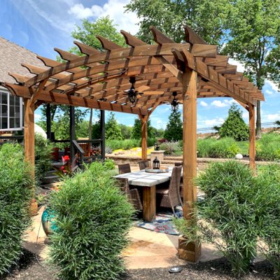 Arched Open Sky Pergolas (Options: 16' L x 14' Arc W, California Redwood, 2 Electrical Wiring Trims, 4-Post Anchor Kit for Concrete, 2 Ceiling Fan Bases, No Privacy Panels, No Curtain Rods, 9' Post Height, Transparent Premium Sealant). Photo Courtesy of J. Buck of Kansas City, Missouri.