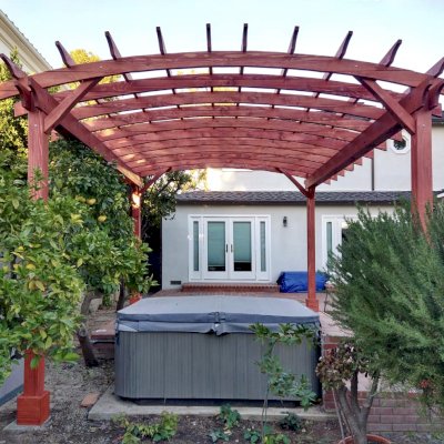 Arched Open Sky Pergolas (Options: 18' L x 15' Arc W, Douglas-fir, 2 Electrical Wiring Trims, 4-Post Anchor Kit for Concrete, No Ceiling Fan Base, No Privacy Panels, No Curtain Rods, 9' Post Height, Custom Stain). Photo Courtesy of K. Jefferson of Santa Monica, CA.