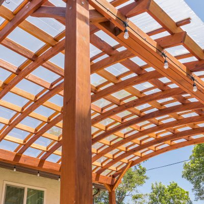 Arched Open Sky Pergolas (Options: 18' L x 16' Arc W, California Redwood, with Rain Guard, Electrical Wiring Trim for All Posts, 4-Post Anchor Kit for Concrete, No Ceiling Fan Base, No Privacy Panels, No Curtain Rods, 9.5' Post Height, Transparent Premium Sealant).