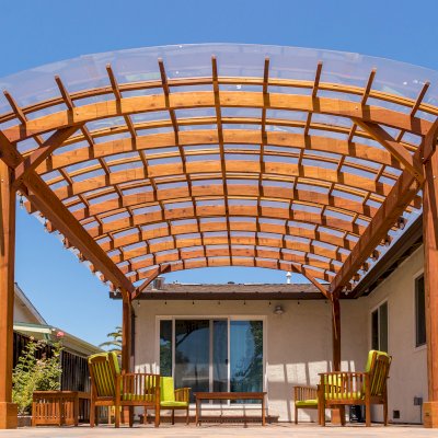 Arched Open Sky Pergolas (Options: 18' L x 16' Arc W, California Redwood, with Rain Guard, Electrical Wiring Trim for All Posts, 4-Post Anchor Kit for Concrete, No Ceiling Fan Base, No Privacy Panels, No Curtain Rods, 9.5' Post Height, Transparent Premium Sealant).