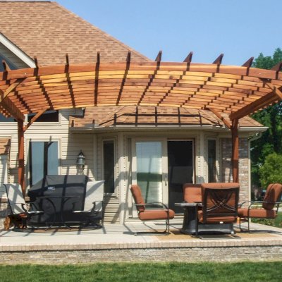 Arched Open Sky Pergolas (Options: 20' L x 18' Arc W, California Redwood, Unattached, No Electrical Wiring Trim, Arched Roof without Lattice Panels, 4-Post Anchor Kit for Stone, No Ceiling Fan Base, No Privacy Panels, No Curtain Rods, 9.5' Post Height, Transparent Premium Sealant). Photo Courtesy of David Gordon of Newport, Michigan. 
