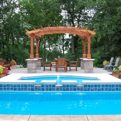 Arched Open Sky Pergolas (Options: 10' L x 14' Arc W, California Redwood, Unattached, No Electrical Wiring Trim, Arched Roof Without Lattice Panels, 4-Post Anchor Kit for Stone, No Ceiling Fan Base, No Privacy Panels, No Curtain Rods, Custom Post Height, Transparent Premium Sealant). Photo Courtesy of Glen Vick of Lafayette, IN. Table set under Pergola not built by Forever Redwood.
