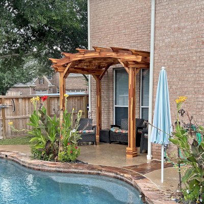 Arched Pergola Kit (Options: 8' L x 12' Arc W, Lattice Privacy Panels, Mosaic Redwood, No Electrical Wiring Trims, No Ceiling Fan Base, No Curtain Rod, No Privacy Panel, Transparent Premium Sealant). Photo Courtesy of E. Buffamante of Richmond, TX.