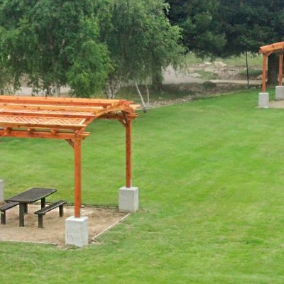 Arched Pergola Kits (Options: 16' L x 16' Arc W, California Redwood, No Electrical Wiring Trim, 4-Post Anchor Kit for Stone, No Ceiling Fan Base, No Privacy Panels, No Curtain Rods, 9' Post Height, Transparent Premium Sealant). 