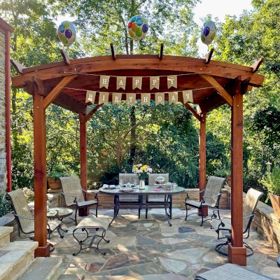 Arched Pergola Kit (Options: 12' L x 12' Arc W, No Privacy Panels, Mature Redwood, No Electrical Wiring Trims, No Ceiling Fan Base, No Curtain Rod, No Privacy Panel, Transparent Premium Sealant). Photo Courtesy of L. Howard of Nashville, TN.