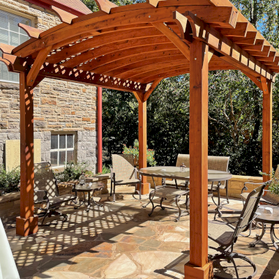 Arched Pergola Kit (Options: 12' L x 12' Arc W, No Privacy Panels, Mature Redwood, No Electrical Wiring Trims, No Ceiling Fan Base, No Curtain Rod, No Privacy Panel, Transparent Premium Sealant). Photo Courtesy of L. Howard of Nashville, TN.