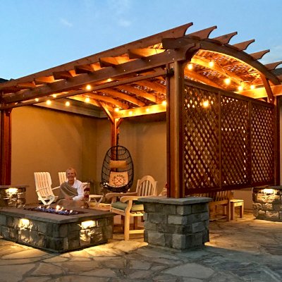 Arched Pergola Kit (Options: 18' L x 14' Arc W, Lattice Privacy Panels, Douglas-fir, No Electrical Wiring Trims, No Ceiling Fan Base, 1 Curtain Rod, 1 Full Wall Lattice Privacy Panel, Transparent Premium Sealant). Photo Courtesy of M. Kennedy of Castle Rock, CO.