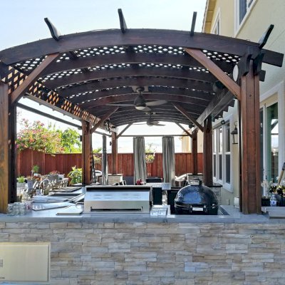 Arched Pergola Kit (Options: 26' L x 12' Arc W, California Redwood, 2 Electrical Wiring Trims, Vertical Post Decorative Trims, 2 Fan Bases, 2 Curtain Rods, No Privacy Panels, Coffee-Stain Premium Sealant). Photo Courtesy of D. Jackson of San Jose, California.