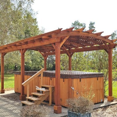 Arched Pergola Kit (Options: 22' L x 14' Arc W, California Redwood, Electrical Wiring Trim Kit for 2 Posts, 6-Post Anchor Kit for Concrete, 1 Ceiling Fan Base, No Privacy Panels, No Curtain Rods, 10' Post Height, Transparent Premium Sealant). Photo Courtesy of D. Lewis of Whiteville, North Carolina.