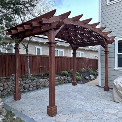 Arched Pergola Kit (Options: 10' L x 16' Arc W, No Privacy Panels, Mosaic Redwood, Horizontal Post Decorative Trims, Viking End Cut Detail, 1 Electrical Wiring Trim, 9.5' H Posts, No Curtain Rod, No Privacy Panel, 4-Post Anchor Kit for High-Wind, Coffee-Stain Premium Sealant). Photo Courtesy of F. Castillo of Livermore, CA.