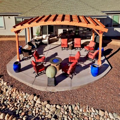 Arched Pergola Kit (Options: 10' L x 24' Arc W, Douglas-fir, No Electrical Wiring Trim Kit, 4-Post Anchor Kit for Concrete, No Ceiling Fan Base, No Privacy Panels, No Curtain Rods, 9' Post Height, Transparent Premium Sealant). Photo Courtesy of Hank Dolan of Prescott, Arizona.