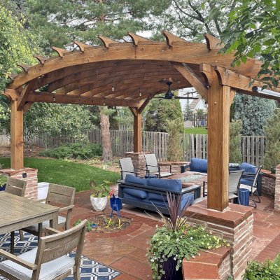 Arched Pergola Kit. (Options: 15' L x 16' Arc W, California Redwood, Electrical Wiring Trim Kit for 2 Posts, with a Ceiling Fan Base, 8X8 Posts by Custom Request, Transparent Premium Sealant). Photo Taken 3 Years After Installation. Photo Courtesy of J. Brown of Inglewood, CO.