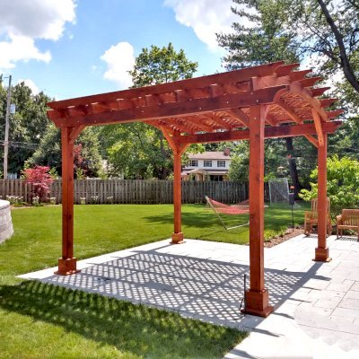 Arched Pergola Kit (Options: 14' L x 14' Arc W, California Redwood, Electrical Wiring Trim Kit for 1 Post, 4-Post Anchor Kit for Concrete, 1 Ceiling Fan Base, No Privacy Panels, No Curtain Rods, 9.5' Post Height, Transparent Premium Sealant). Photo Courtesy of K. Murray of Grand Rapids, Michigan.