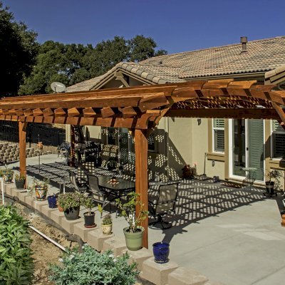 Arched Pergola Kit (Options: 39' L x 16' Arc W, California Redwood, Electrical Wiring Trim Kit for 2 Posts, 6-Post Anchor Kit for Concrete, 2 Ceiling Fan Bases, No Privacy Panels, No Curtain Rods, 9.5' Post Height, Transparent Premium Sealant). Photo Courtesy of S. Brunshwiler of Gilroy, CA,