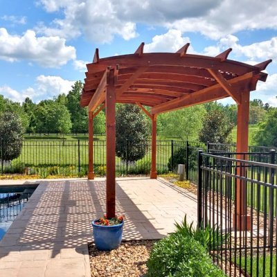 Arched Pergola Kit (Options: 24' L x 10' Arc W, California Redwood, Electrical Wiring Trim Kit for 1 Post, 4-Post Anchor Kit for Concrete, 1 Ceiling Fan Base, No Privacy Panels, No Curtain Rods, 9' Post Height, Transparent Premium Sealant). Photo Courtesy of J. Goldberg of Earlysville, Virginia.