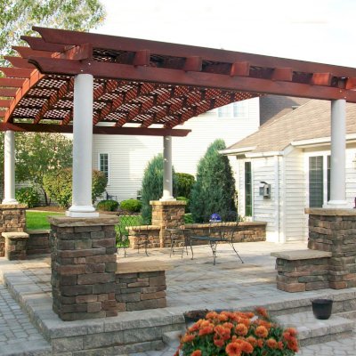 Arched Pergola Kits (Options: 15' L x 20' Arc W, Mature Redwood, No Electrical Wiring Trim, 4-Post Anchor Kit for Stone, No ceiling Fan Base, No Privacy Panels, No Curtain Rods, 10' Post Height, Cherry Stain Premium Sealant). Photo Courtesy of Mr. Gary B. of Depew, WN.