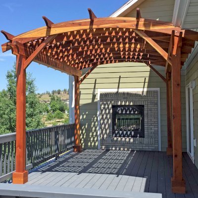 Arched Pergola Kits (Options: 16' L x 12' Arc W, California Redwood, No Electrical Wiring Trim, 4-Post Anchor Kit for Wood, No Ceiling Fan Base, with No Privacy Panels, No Curtain Rods, Transparent Premium Sealant). Photo Courtesy of B. McPherson of Billings, MT.