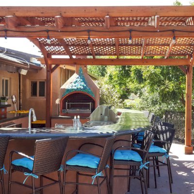 Arched Pergola Kits (Options: 15' L x 15' Arc W, Old-Growth Redwood, Electrical Wiring Trim for 2 Posts, 4-Post Anchor Kit for Stone, 1 Ceiling Fan Base, No Privacy Panels, No Curtain Rods, 9' Post Height, Transparent Premium Sealant). Photo Courtesy of Dennis Landall of Arcadia, CA. 