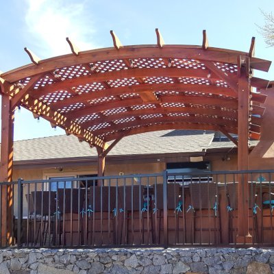 Arched Pergola Kits (Options: 15' L x 15' Arc W, Old-Growth Redwood, Electrical Wiring Trim for 2 Posts, 4-Post Anchor Kit for Stone, 1 Ceiling Fan Base, No Privacy Panels, No Curtain Rods, 9' Post Height, Transparent Premium Sealant). Photo Courtesy of Dennis Landall of Arcadia, CA. 