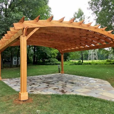 Arched Pergola Kit (Options: 24' L x 24' Arc W, Douglas-fir, Electrical Wiring Trim Kit for 2 Posts, 4-Post Anchor Kit for High-Wind, 1 Ceiling Fan Base, No Privacy Panels, No Curtain Rods, 9.5' Post Height, Transparent Premium Sealant). Photo Courtesy of D. Juiliano of Randolph, NJ.