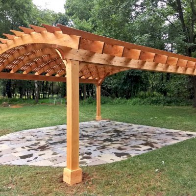 Arched Pergola Kit (Options: 24' L x 24' Arc W, Douglas-fir, Electrical Wiring Trim Kit for 2 Posts, 4-Post Anchor Kit for High-Wind, 1 Ceiling Fan Base, No Privacy Panels, No Curtain Rods, 9.5' Post Height, Transparent Premium Sealant). Photo Courtesy of D. Juiliano of Randolph, NJ.