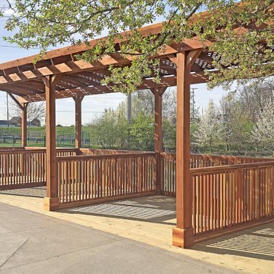 Arched Pergola Kits (Options: 40' L x 14' Arc W, California Redwood, No Electrical Wiring Trim, 10-Post Anchor Kit for Wood, 2 Ceiling Fan Bases, No Curtain Rods, Transparent Premium Sealant). Privacy stalls added by custom request. Photo Courtesy of D. Hatcher of Lewis Center, OH.