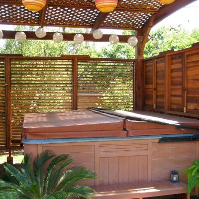 Arched Pergola Kits (Options: 16' L x 14' Arc W, California Redwood, 2 Post Electrical Wiring Trim, 4-Post Anchor Kit for Stone, No Ceiling Fan Base, 3 Shutter Privacy Panels half height with Wall [Custom Lexan Roofing for Additional Privacy and Water Protection. If you are interested in either of these custom details, let us know.], No Curtain Rods, 9' Post Height,Transparent Premium Sealant. Photo courtesy of Ms. Debbie C, Costa Mesa, CA.