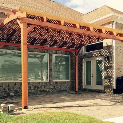 Arched Pergola Kits (Options: 18' L x 15' Arc W, Mature Redwood, No Electrical Wiring Trim, 4-Post Anchor Kit for Stone, No Ceiling Fan Base, No Privacy Panels, No Curtain Rods, 10' Post Height, Transparent Premium Sealant). Photo Courtesy of Andrew Snoddy of Little River, South Carolina.