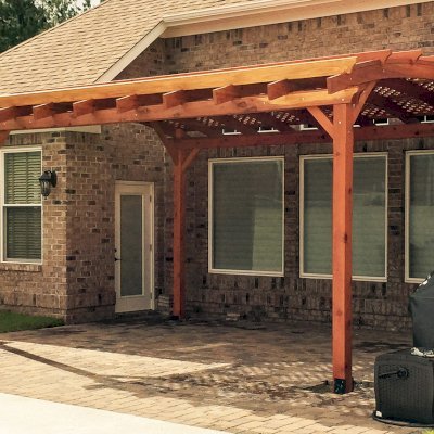 Arched Pergola Kits (Options: 18' L x 15' Arc W, Mature Redwood, No Electrical Wiring Trim, 4-Post Anchor Kit for Stone, No Ceiling Fan Base, No Privacy Panels, No Curtain Rods, 10' Post Height, Transparent Premium Sealant). Photo Courtesy of Andrew Snoddy of Little River, South Carolina.