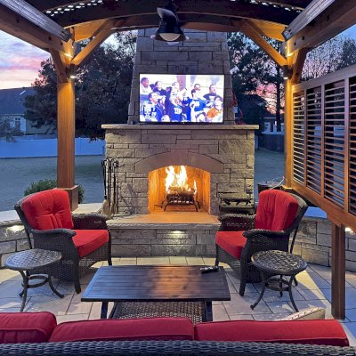 Arched Pergola Kit (Options: 12' L x 12' Arc W, California Redwood, No Electrical Wiring Trim, 4-Post Anchor Kit for Concrete, 1 Ceiling Fan Base, 1 Louver Privacy Panel, No Curtain Rods, Transparent Premium Sealant, 2 Posts Wrapped in Masonry, 8 x 8 Posts by Custom Request). Photo Courtesy of S. Hunter of Fort Smith, AR.