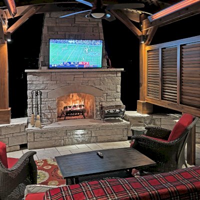 Arched Pergola Kit (Options: 12' L x 12' Arc W, California Redwood, No Electrical Wiring Trim, 4-Post Anchor Kit for Concrete, 1 Ceiling Fan Base, 1 Louver Privacy Panel, No Curtain Rods, Transparent Premium Sealant, 2 Posts Wrapped in Masonry, 8 x 8 Posts by Custom Request). Photo Courtesy of S. Hunter of Fort Smith, AR.