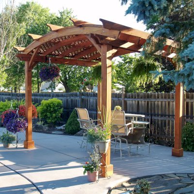 Arched Pergola Kits (Options: 12' L x 12' Arc W, Mature Redwood, No Electrical Wiring Trim, 4-Post Anchor Kit for Stone, No Ceiling Fan Base, No Privacy Panels, No Curtain Rods, 9' Post Height, Transparent Premium Sealant). Photo Courtesy of Jim Beatty of North Tonawanda, NY.