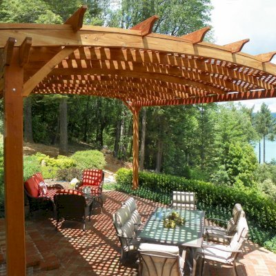 Arched Pergola Kits (Options: 20' L x 18' Arc W, Mature Redwood, No Electrical Wiring Trim, 4-Post Anchor kit for Stone, No Ceiling Fan Base, No Privacy Panels, No Curtain Rods, 10' Post Height, Transparent Premium Sealant). Photo Courtesy of Edward G. of Nevada City, CA.