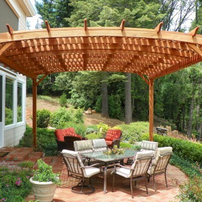 Arched Pergola Kits (Options: 20' L x 18' Arc W, Mature Redwood, No Electrical Wiring Trim, 4-Post Anchor Kit for Stone, No ceiling Fan Base, No Privacy Panels, No Curtain Rods, 10' Post Height, Transparent Premium Sealant). Photo Courtesy of Edward G. of Nevada City, CA.