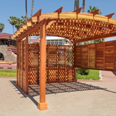 Arched Pergola Kits (Options: 16' L x 14' Arc W, California Redwood, No Electrical Wiring Trim, 4-Post Anchor Kit for Stone, No Ceiling Fan Base, Privacy Panels & Louvers, No Curtain Rods, 9' Post Height, Transparent Premium Sealant). Photo Courtesy of George Jackson of Commerce Township, Michigan.