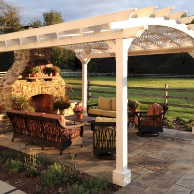 Arched Pergola Kits (Options: 18' L x 16' Arc W, California Redwood, Electrical Wire Trim for 1 Post, 4-Post Anchor Kit for Stone, Ceiling Fan Base, No Privacy Panels, No Curtain Rods, 9' Post Height, Off-White Oil-Based Primer). Photo Courtesy of Robert Stover of Center Valley, Pennsylvania.