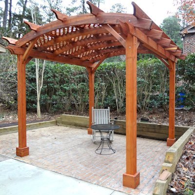Arched Pergola Kits (Options: 12' L x 12' Arc W, Mature Redwood, No Electrical Wiring Trim, 4-Post Anchor Kit for Stone, No Ceiling Fan Base, No Privacy Panels, No Curtain Rods, 9' Post Height, Transparent Premium Sealant). Photo courtesy of Reuben Prichard of Raleigh, North Carolina.
