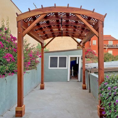 Arched Pergola Kit (Options: 12' L x 9' Arc W, California Redwood, No Overhangs by Custom Request, No Electrical Wiring Trim Kit, No Fan Base, No Privacy Panels, Transparent Premium Sealant). Photo Courtesy of R. Rabinov of Ventura, California.